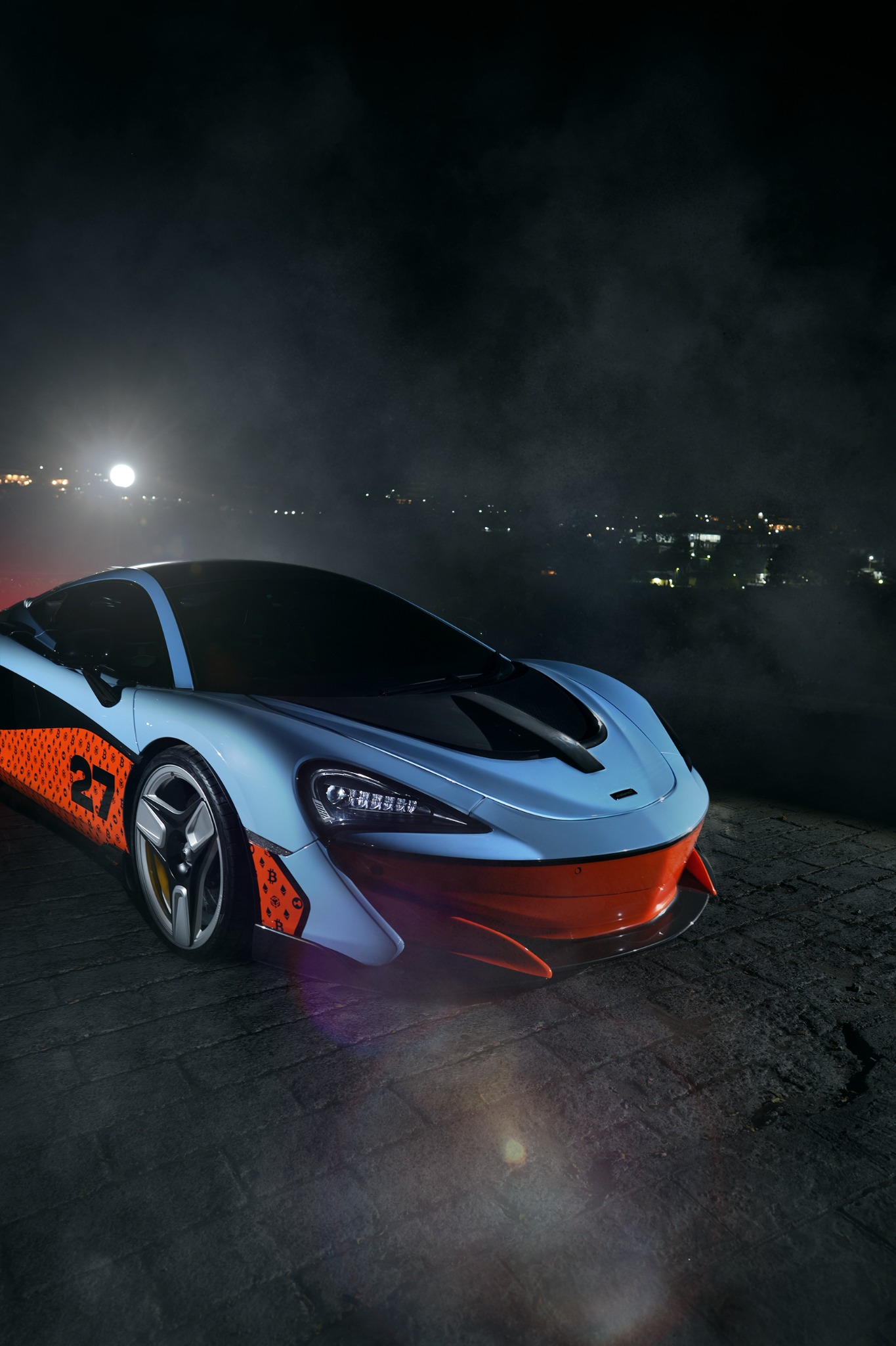 Blue and orange performance car at night